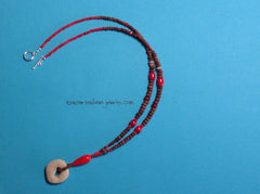 Necklace with stone pendant and red coral